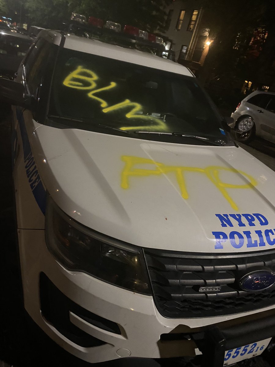 Saw two police cars with FTP (fuck the police) spray painted. One had a window kicked in. Another has both its mirrors ripped off. But police were close when this was happening, police had pulled back and did not interfer.