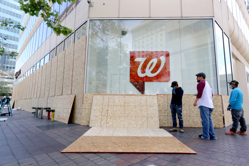 A protest in  #Oakland is in its beginning stages. A large demonstration is expected to begin at 8 p.m. at Frank Ogawa Plaza but some people are already marching. Nearby businesses have boarded up windows in anticipation. Photos by  @rayinaction  #GeorgeFloydprotest