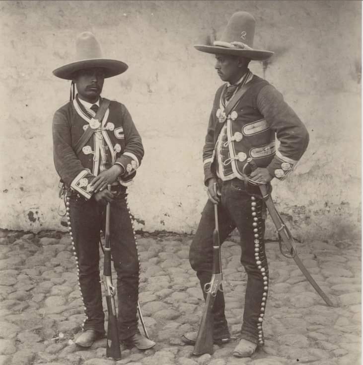 These guys look like Vaqueros on a cattle drive, not guests at a formal event. I'm not an expert on Rurales so I'm awaiting a response from my friend who is (and who, by coincidence, appeared in Tombstone)
