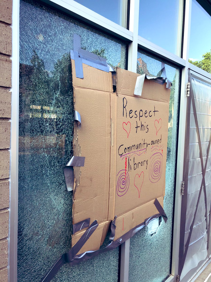 The library is somewhat damaged, smashed computers inside too, but all the books appear untouched. Graffiti suggests killing cops.