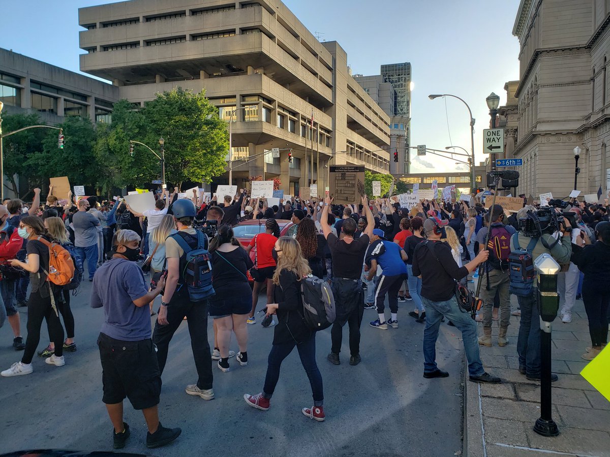 It is the second night of protests for justice for  #BreonnaTaylor in downtown  #Louisville. A large group of protesters at 6th and Jefferson near the Hall of Justice are peaceful and quiet, holding signs with occasional chants of "No justice, no peace."