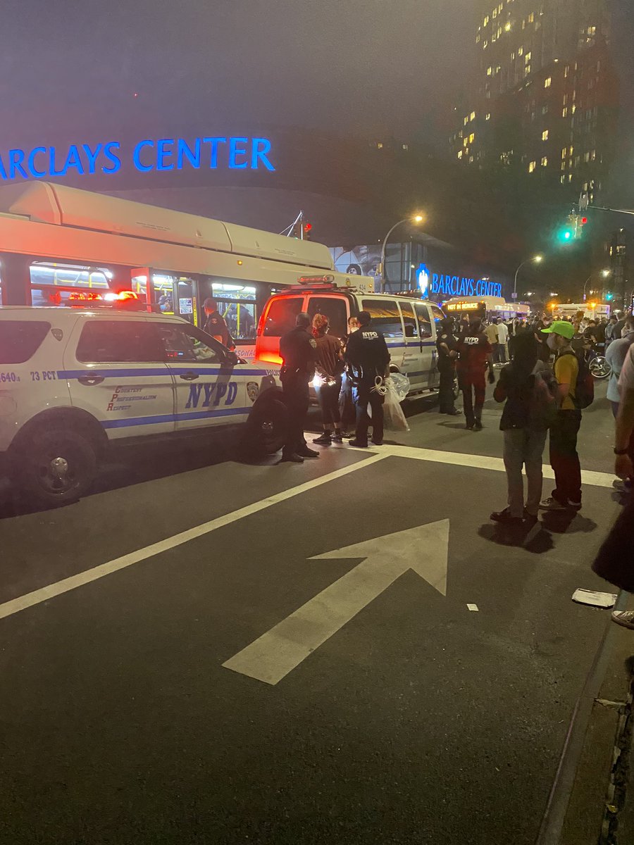 More arrests, police piling them into city buses. A female protester was just wheeled away on a guerney by paramedics, unclear what happened to her.