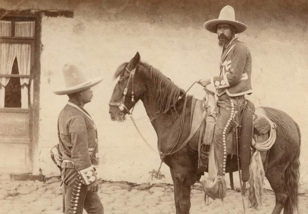 Like why not just have them wear sombreros and dress suits? They had to go out of their way to put them in matching chaps. I'm imagining all the groomsmen at a Friar Tux shop all trying them on.