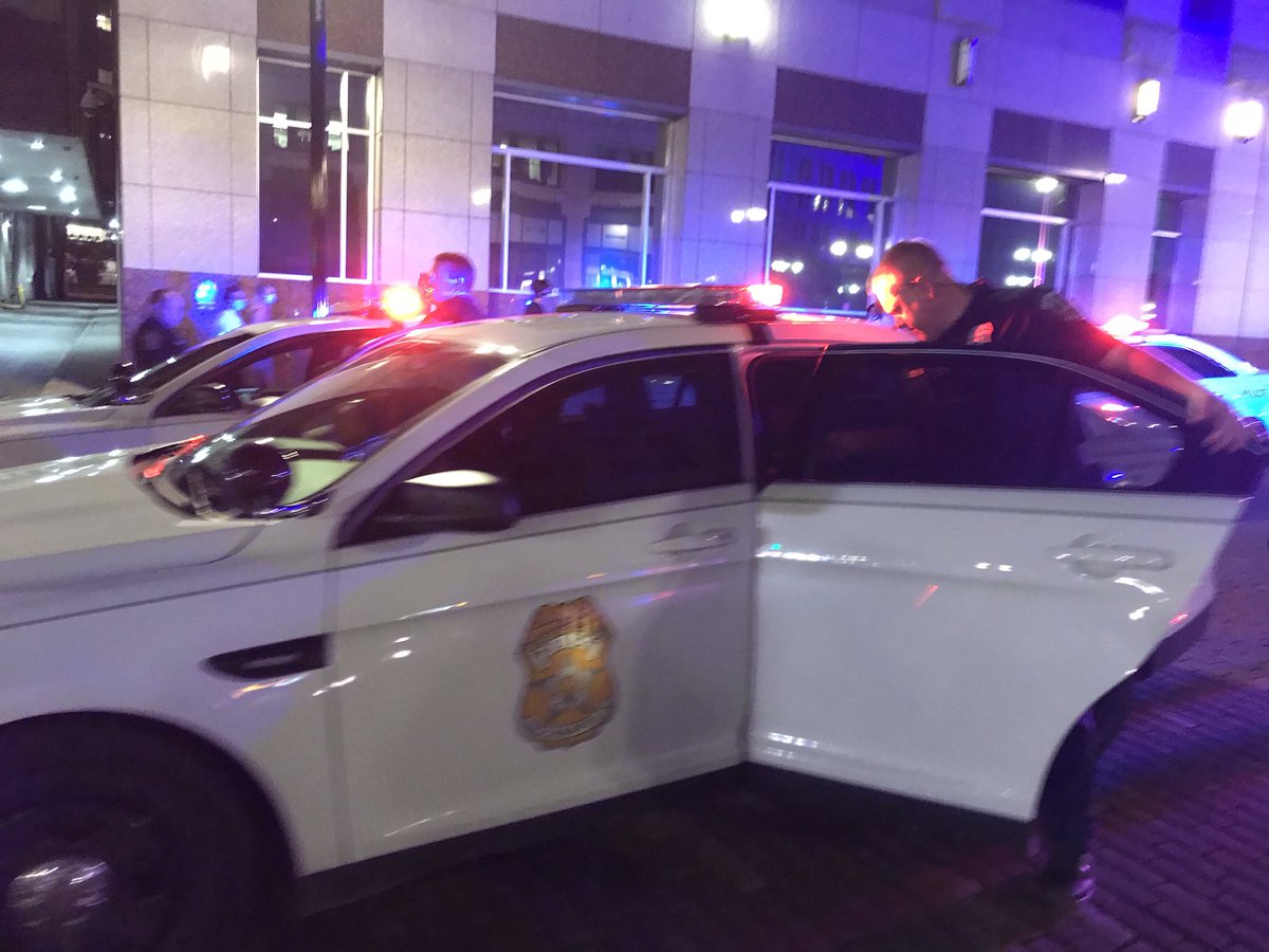 Officers getting into six squad cars on Market St