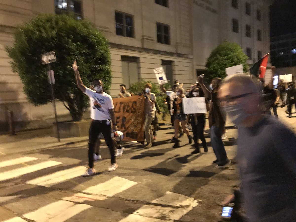 The demonstration has moved east down Washington. “The people, united, will never be divided.” A handful of police cars were at the end of North Main, though the demonstration did not continue that way.