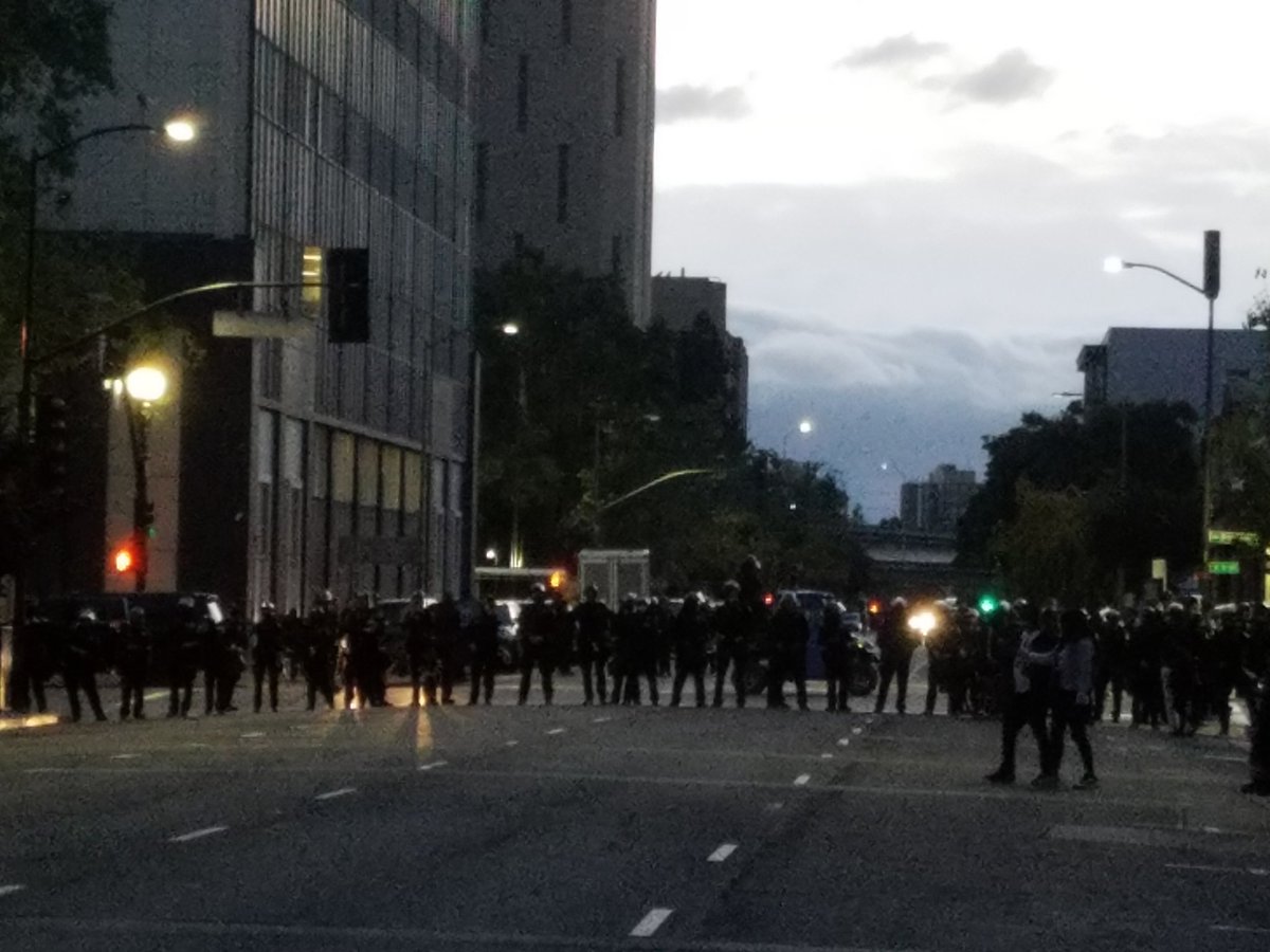 OPD has a big line of effort cops on 7th at Broadway to protect their HQ. March fragments, some heading east on 7th, others to confront police.
