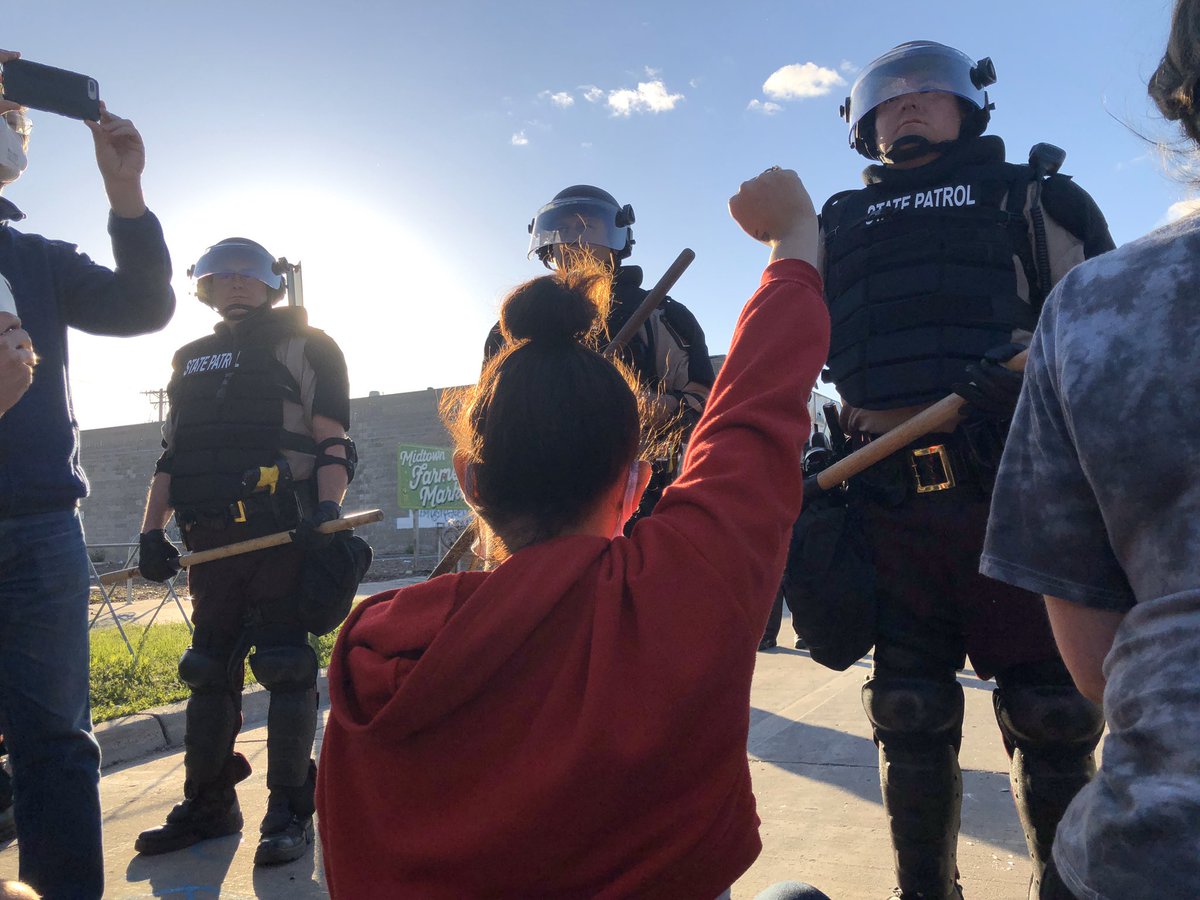 I was tear gassed today. With dozens of other peaceful protestors as we kneeled on our knees and begged. BEGGED not to be harmed. The person being carried in the second photo was shot in front of my eyes with rubber bullets by police.