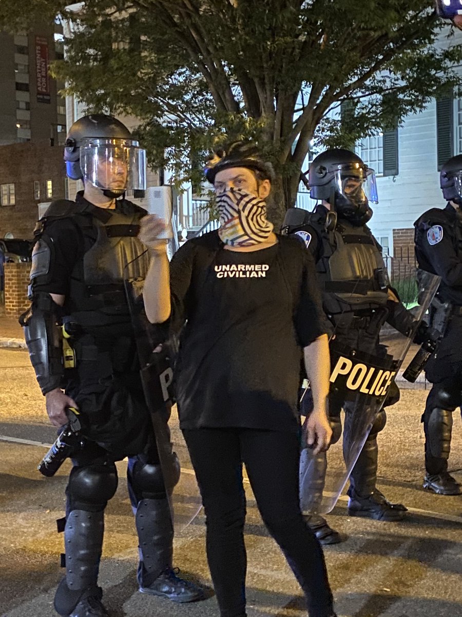 she wants to hang out with cops so bad, she got what she wanted. cops just escorted her away behind the police line. unclear if she was arrested or just gently removed.