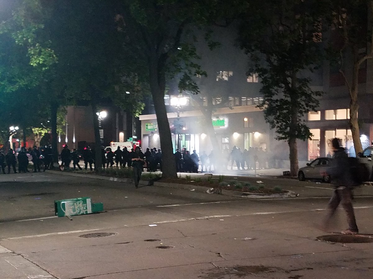 Teargas everywhere. Up 8th St and Broadway in these two photos. Small crews breaking off now and smashing and painting call over in vicinity. Good job, Schaaf, you've spread protesters all over downtown.