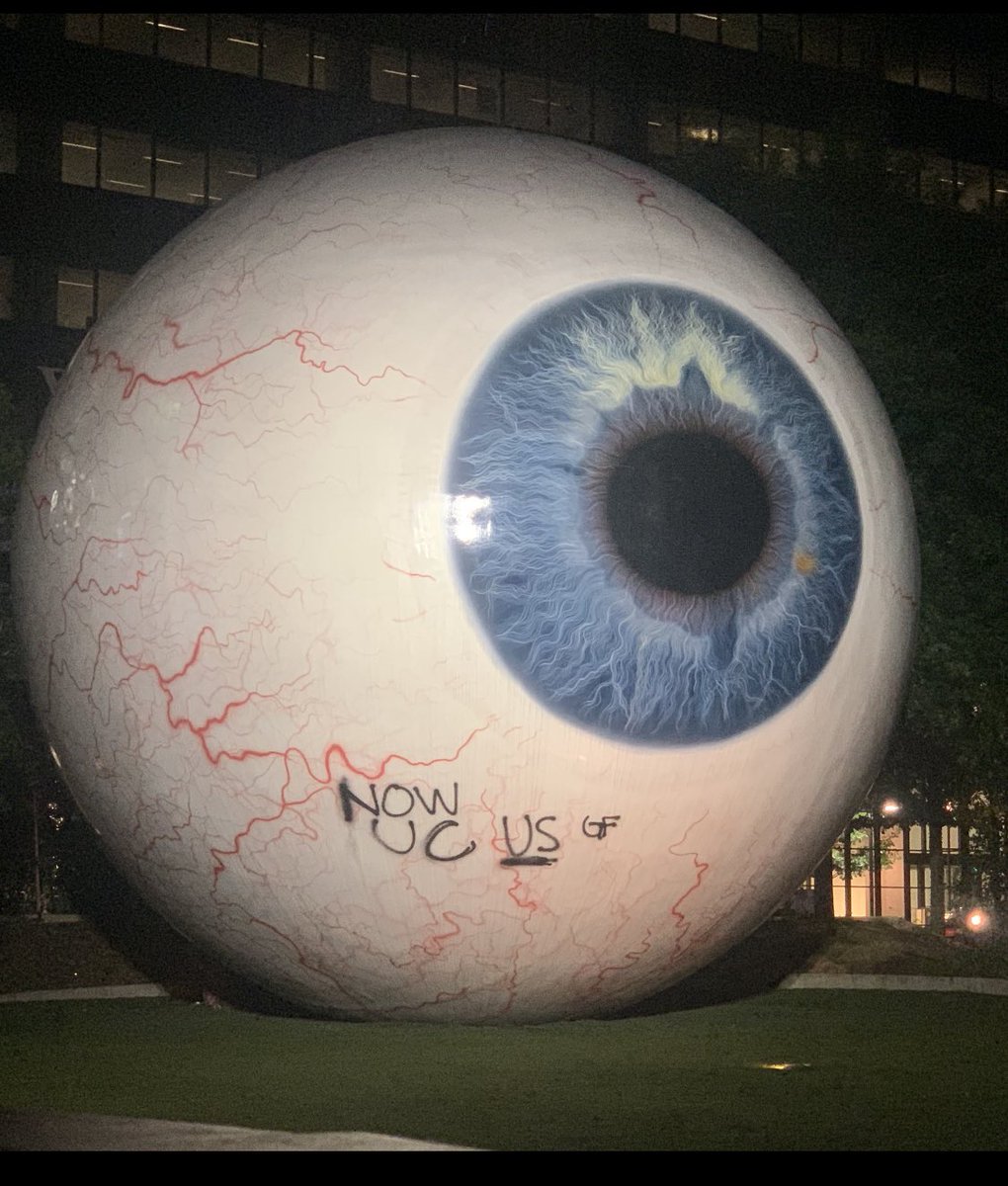 rlopezwfaa's tweet photo. Someone spray painted “Now you C us” on this art work week in downtown Dallas.  @wfaa https://t.co/zSAPL4loUa