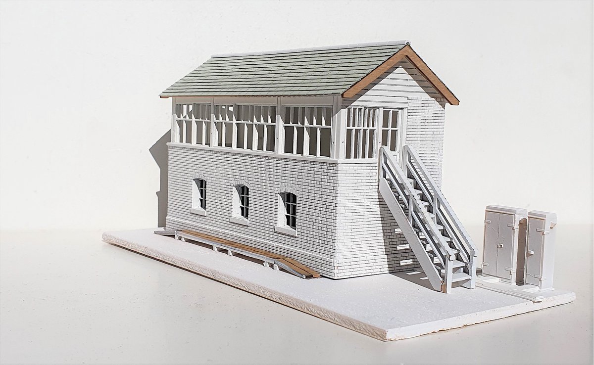 wrt_77's tweet photo. Progressing my signal box build. Tidied brickwork, fixed broken window (doh) & embedded window arches (causing said broken window). Dusting of white primer to see large mistakes. Next up guttering and interior... Qn - Should a late 80s SB have a chimney? #TMRGUK #Timbertracks https://t.co/7tqYa8N7eL