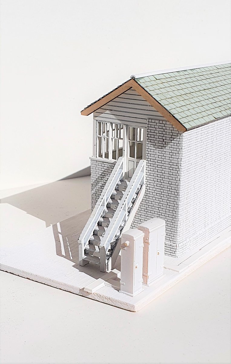 wrt_77's tweet photo. Progressing my signal box build. Tidied brickwork, fixed broken window (doh) & embedded window arches (causing said broken window). Dusting of white primer to see large mistakes. Next up guttering and interior... Qn - Should a late 80s SB have a chimney? #TMRGUK #Timbertracks https://t.co/7tqYa8N7eL