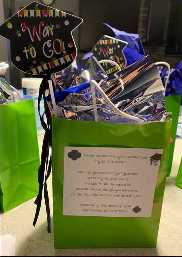 GSNEO's tweet photo. SU 512 made up gift bags for their graduating Girl Scout Ambassadors! Included in the gift bags were candy, 2020 graduate tassel key chains, fortune cookies, GSNEO cups and pens, handmade cards from younger girls, and a signed card from SU team members. #GSNEOPositivityProject https://t.co/XFiG1I22GD