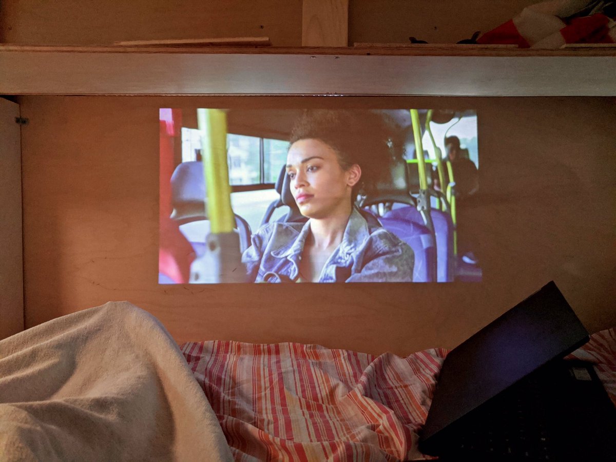 myohoflow's tweet photo. Watching Queen Sono (like a female African James Bond) on Netflix from our super comfy van bed. 😊 https://t.co/CV0GVbulDQ