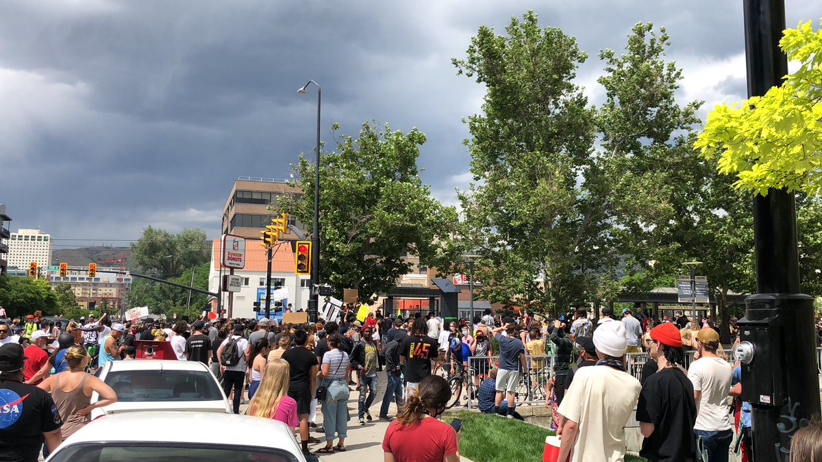 I am currently socially distancing from the overturned  @slcpd police car. Hard to tell exactly what’s happening but I’ve seen smoke rising from the area where it was overturned.  #GeorgeFloydprotest