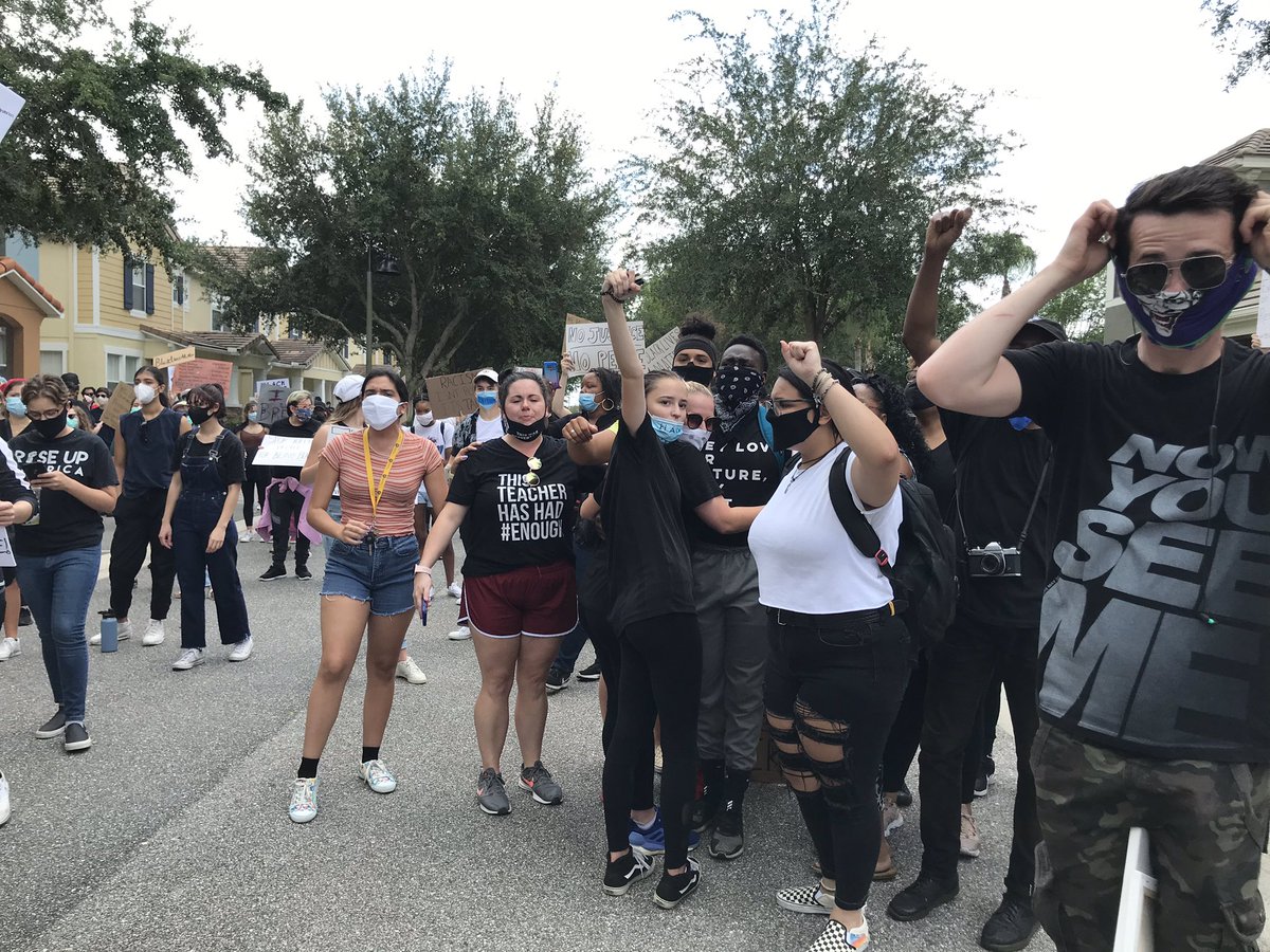 Demonstrators have now filled the street, and a few are encouraging people to walk into the street, fill it (many had been on sidewalks). The street has been blocked off to traffic already by  @OrangeCoSheriff