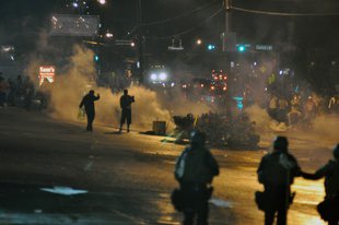 Ferguson, Missouri, 2014+ Riots began after the fatal shooting of Michael Brown by police officer Darren Wilson + MB’s body lay in the street for FOUR HOURS. Police established curfews and deployed riot squads to maintain order before protests began.