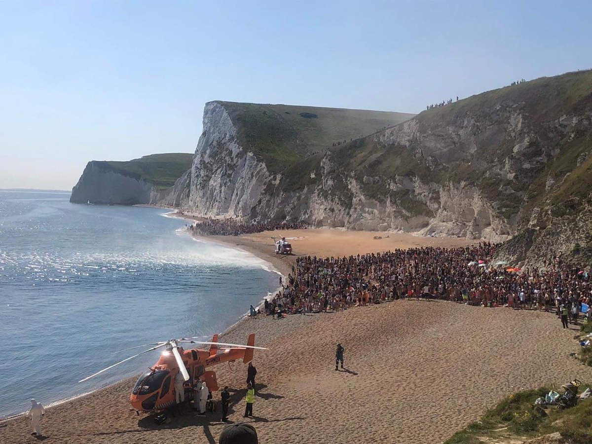 SteveHarrisDJ's tweet photo. Even if we weren’t in the grip of a global pandemic, these images from @PurbeckPolice at Durdle Door, Dorset today are extraordinary. https://t.co/tVQk0pm2Da