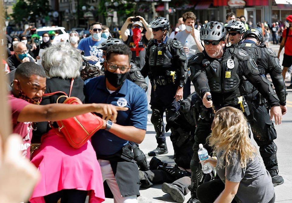 getawayjournals's tweet photo. This is one of those iconic photos that will go down in history when people talk about the protests. [The Columbus City Council President and County Commisioner shielding a 70-year-old Congress Woman as they all get maced by CPD.]

#ColumbusProtest #BlackLivesMatter https://t.co/ZbsgAWlbbJ