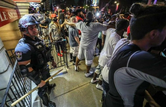DMmarketer's tweet image. This picture speaks a lot the cop over hear had gotten separated from his team and the crowd was going to beat him but a bunch of black people made a circle around him to protect him this clearly shows they aren't here to fight

#BLACK_LIVES_MATTER