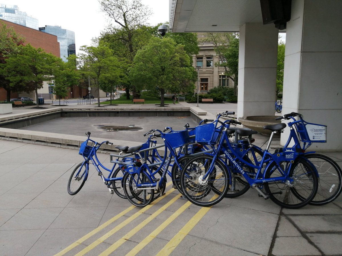 CameronKroetsch's tweet photo. Just walked by @cityofhamilton City Hall to see what I can only describe as a public art demonstration as Hamiltonians say goodbye to their bike share. 👋 ❤️ #SoLongSoBi #HamOnt https://t.co/PJh6iuaeKN