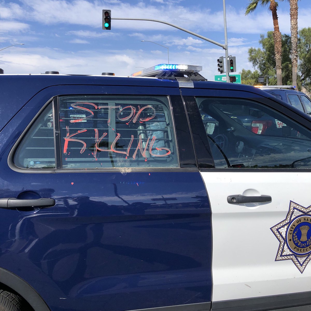 There is some heated confrontation but we try to calm ppl down. The damage tho?Broke squad car windows, one flat tire, and written messages this: STOP KILLING [8]