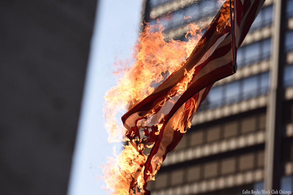 A protester set fire to an American flag at the George W Dunne Cook County Office Building on Washington in Chicago.  #GeorgeFloydProtests