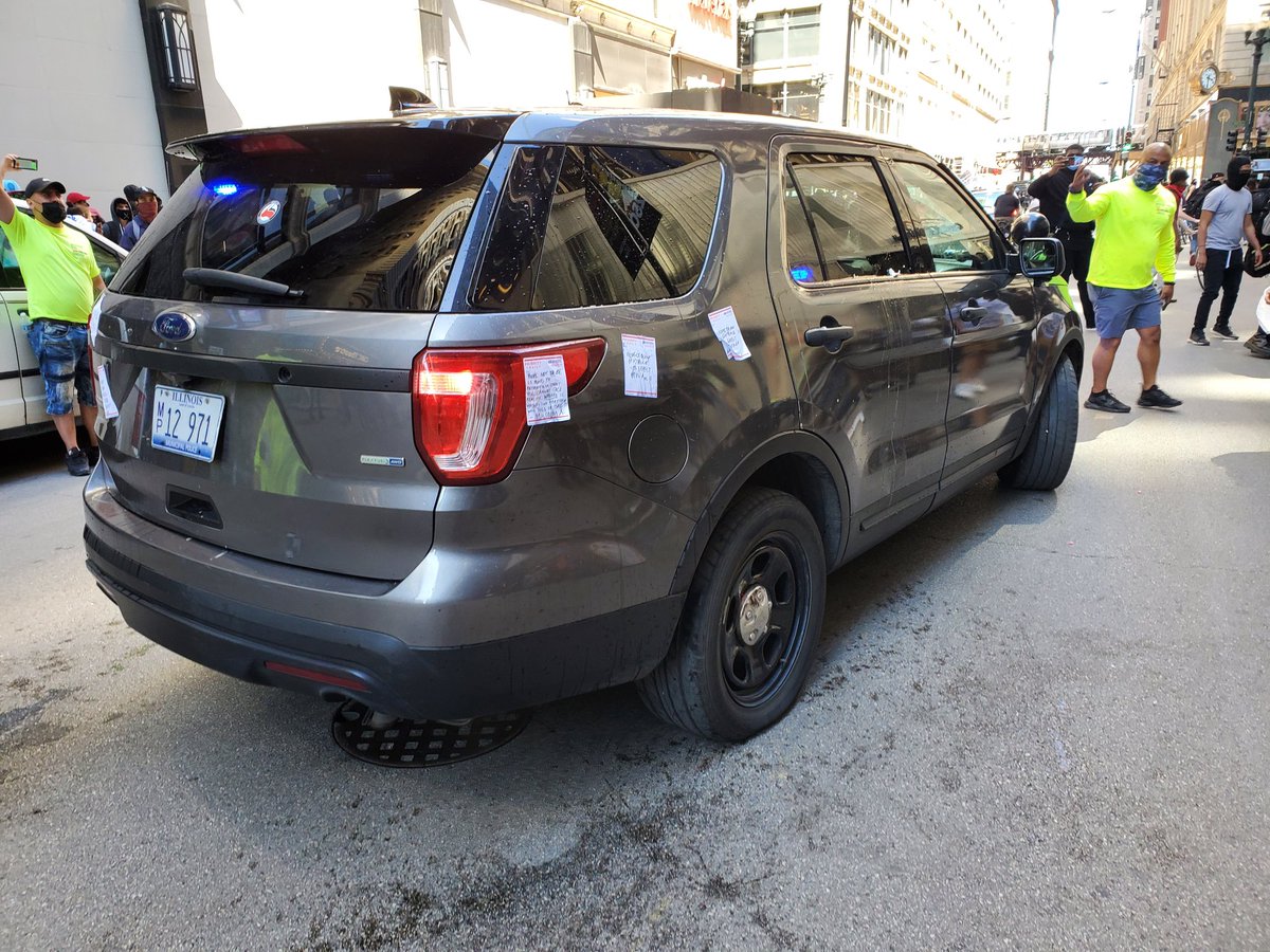 Tags and the tires were popped on the retreating cop car bottles and more water were thrown on it while it fled.  #Chicago  #GeorgeFloyd