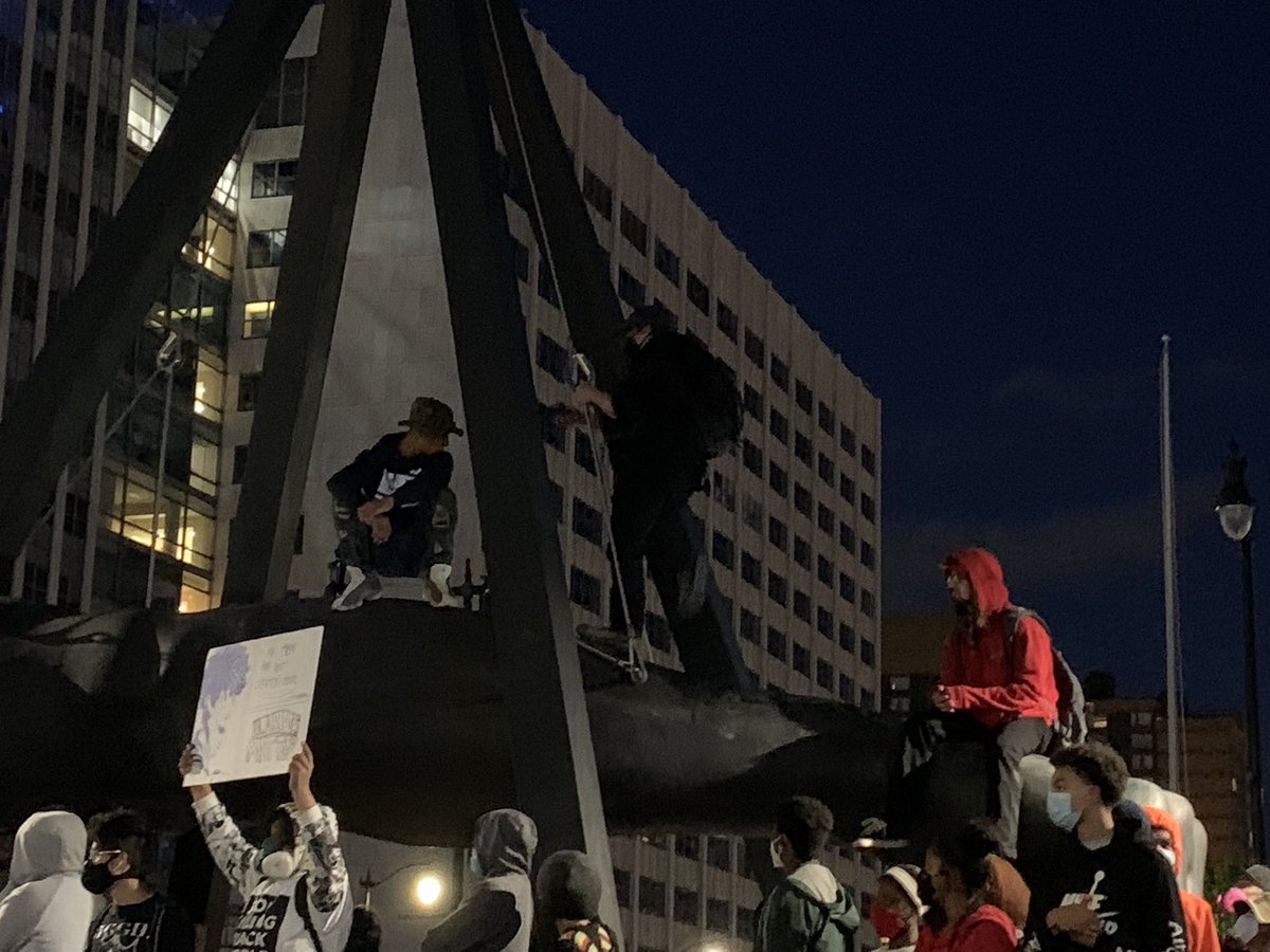 They are literally sitting on the Joe Louis Fist. Someone in the crowd just yelled “we need to kill some cops.”