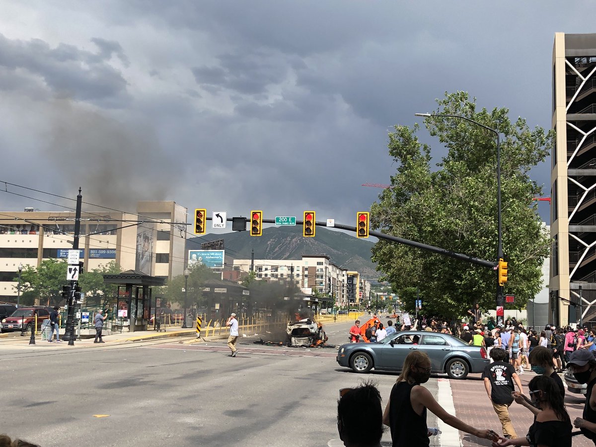 More views of the torched police car and smoke at the  #GeorgeFloydprotest in downtown Salt Lake City.