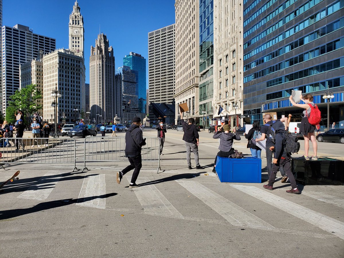 A group of people are collecting spare barricades and trash cans to block off Wacker Drive near Wabash.  #Chicago  #GeorgeFloyd