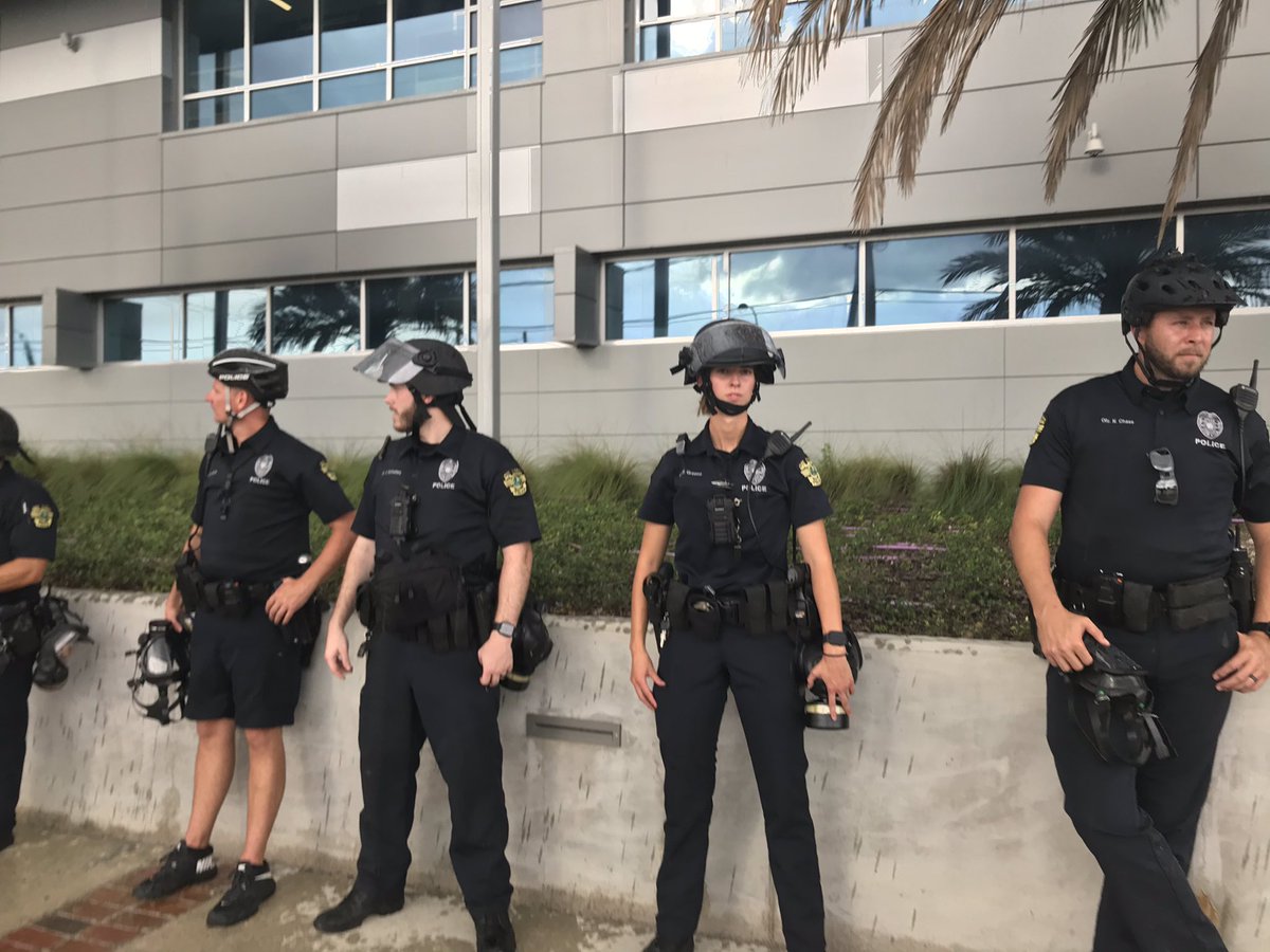 Stopped at  @OrlandoPolice now. At least 300 here (but I’m bad at estimating). Many cops wearing helmet with shield and gas masks ready, but many not.  #GeorgeFloyd