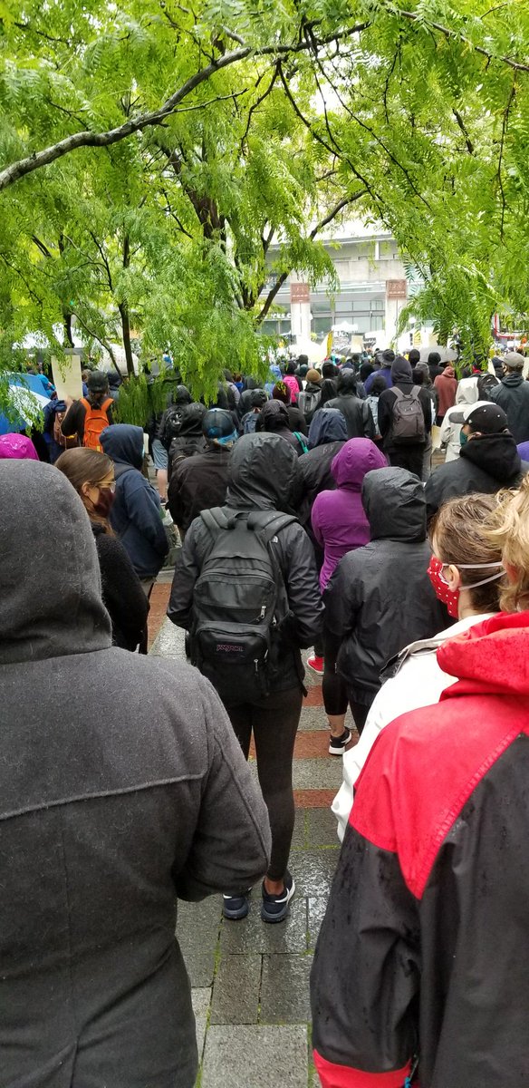 #seattleprotest at Westlake center crowd and presentations are calm and peaceful. However it seems a few blocks away might be a little different.