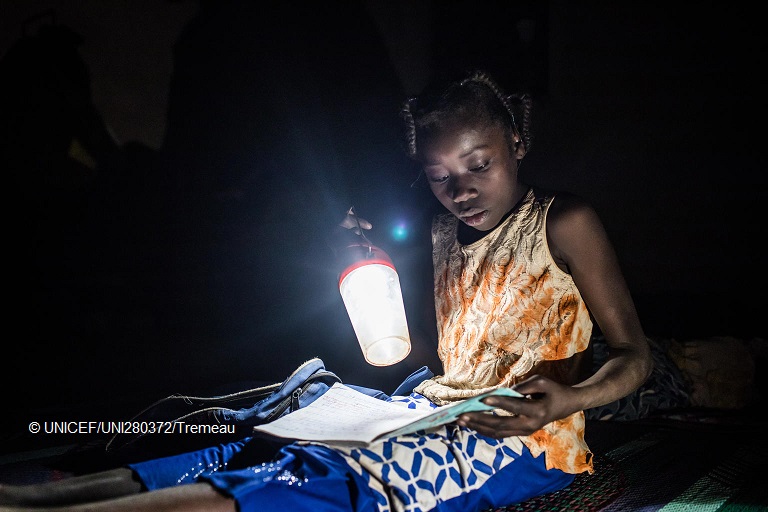 UNICEFEducation's tweet photo. "At school I received some help. I was given schoolbooks and pens, so I could continue to study for my future. I love going to school." - Nabyla, 13, studies at night in a temporary home where her family found refuge after being displaced, in Burkina Faso. https://t.co/OLxlW9n4g1