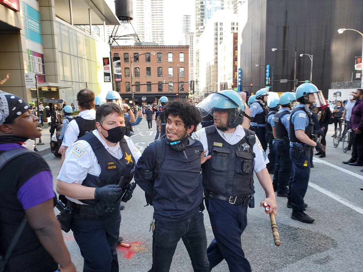 A protesters being carried away by police, the officer in white had to give the guy a few hits on an inhaler as he was passing out.  #Chicago  #GeorgeFloyd