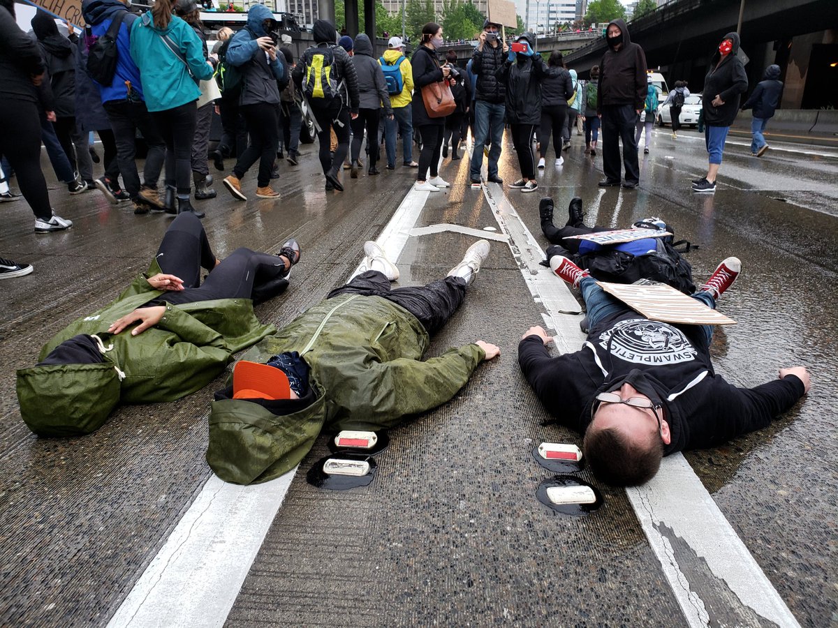 On I-5 where hundreds marched through traffic, this group laid down and chanted, "I can't breathe."