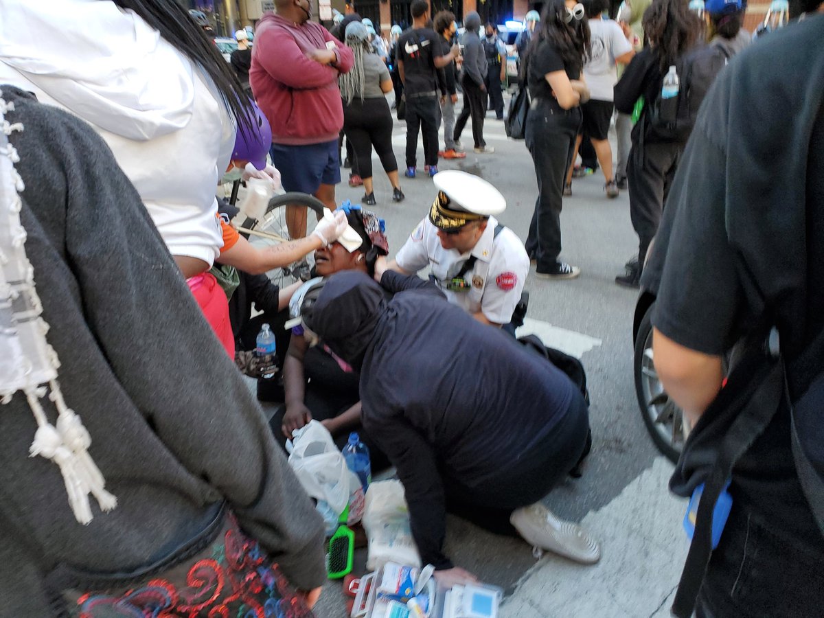 Street medics and CFD are operating on a women who had a bad gash on her head she was in and out of consciousness as people were working on her.  #Chicago  #GeorgeFloyd