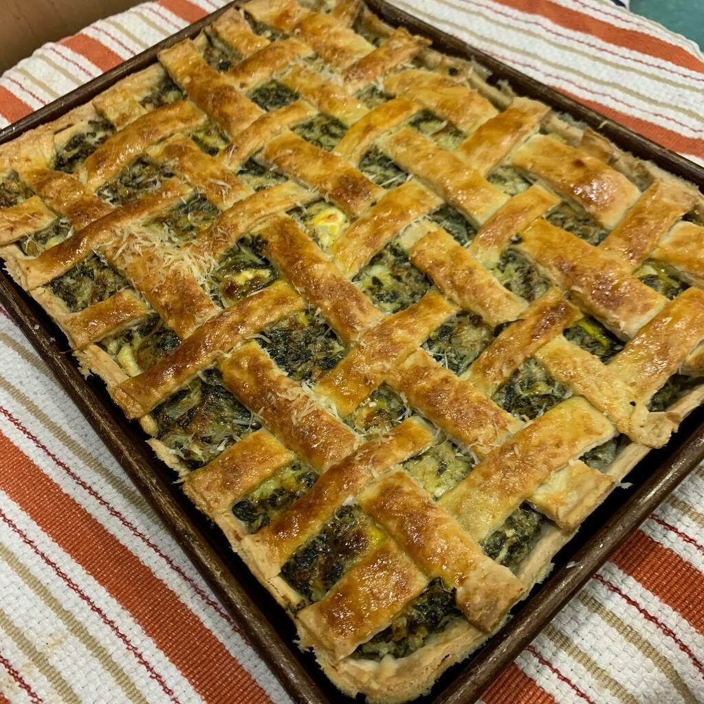 jwscoop's tweet photo. modified a @cathybarrow recipe from #piesquared to accommodate my csa haul and pantry. turned her artichoke dip slab pie into a spinach and artichoke dip slab pie. 
result: delicious, tho i am terrible at latticework https://t.co/nbHHM6oyab https://t.co/SBoiv8na07