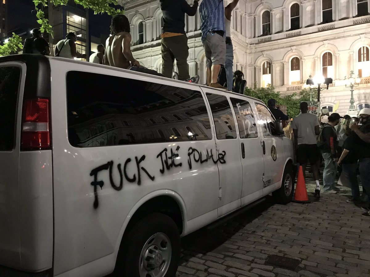 Police van was just vandalized in front of me outside City Hall.