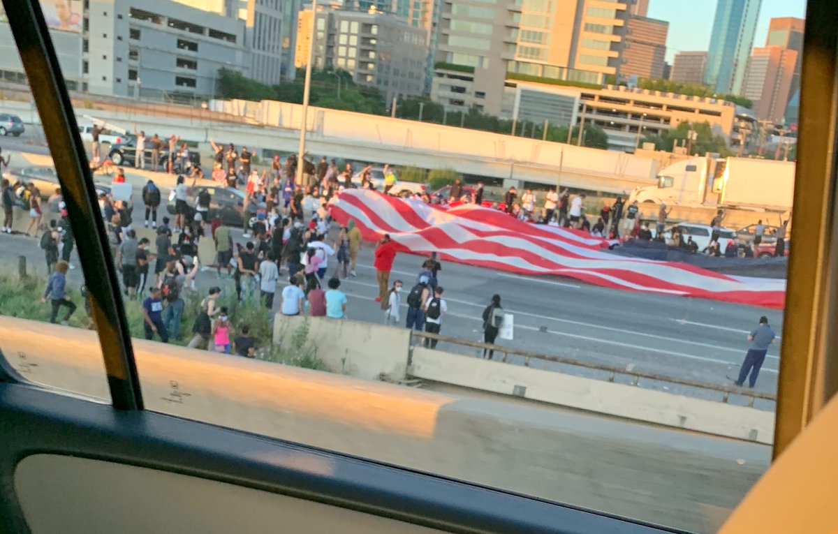 CourtneyWHome's tweet photo. Leaving dinner with friends in Uptown Dallas - traffic on 35 stopped due to protestors in the middle of the highway. @dallasnews https://t.co/tmD6p5wgPs