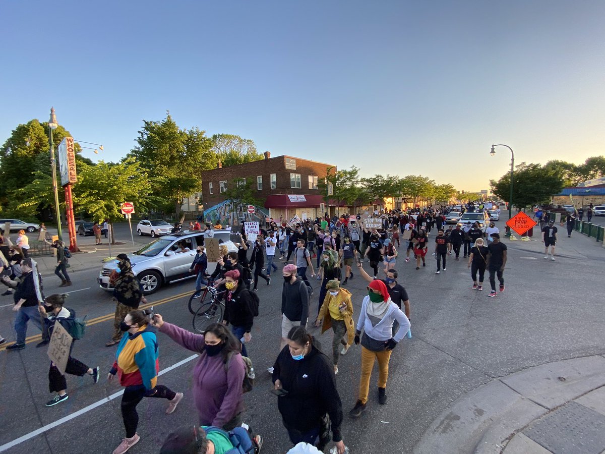 As the 8pm curfew in  #Minneapolis goes into effect, a procession of protestors and cars head west on Lake Street. Peaceful here.