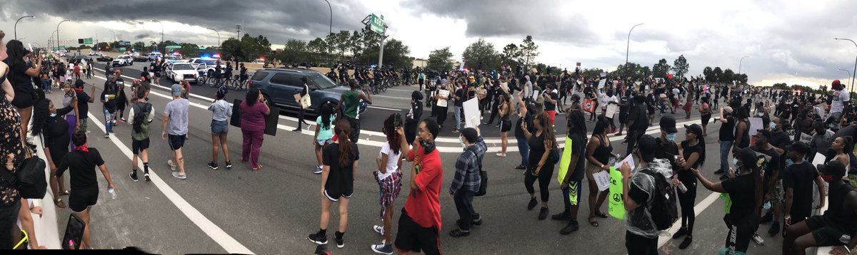 Going thru my footage from today, and still taken aback by this view of the 408, completely filled with demonstrators. Protesters stopped traffic both ways, until tear gas from  @OrlandoPolice dispersed them.  #GeorgeFloyd
