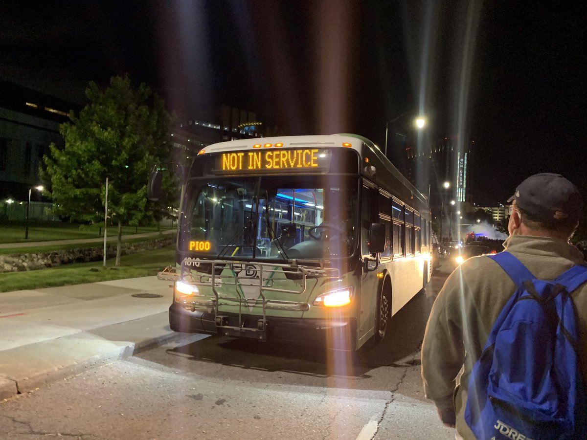 DPD has arrested dozens of people and placed them on a DDOT bus. They appear to be young.