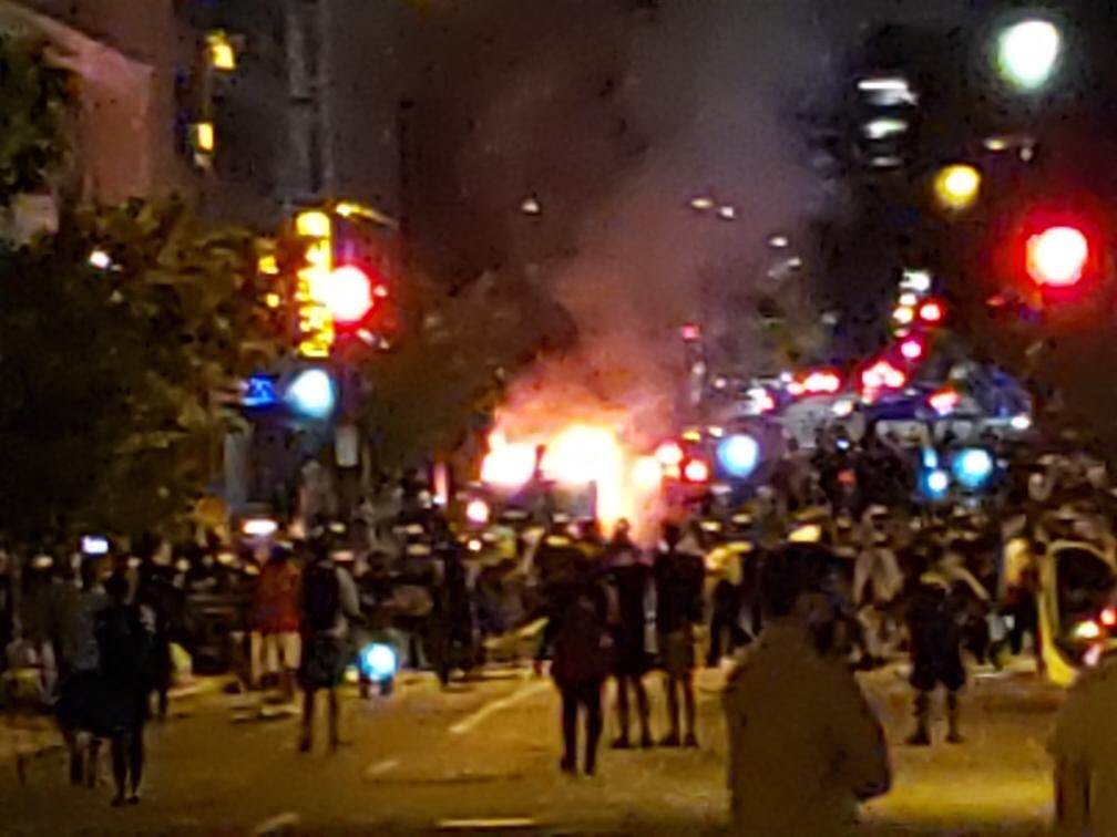 Rioters just lit a car on fire a block away from Lafayette Square Park: