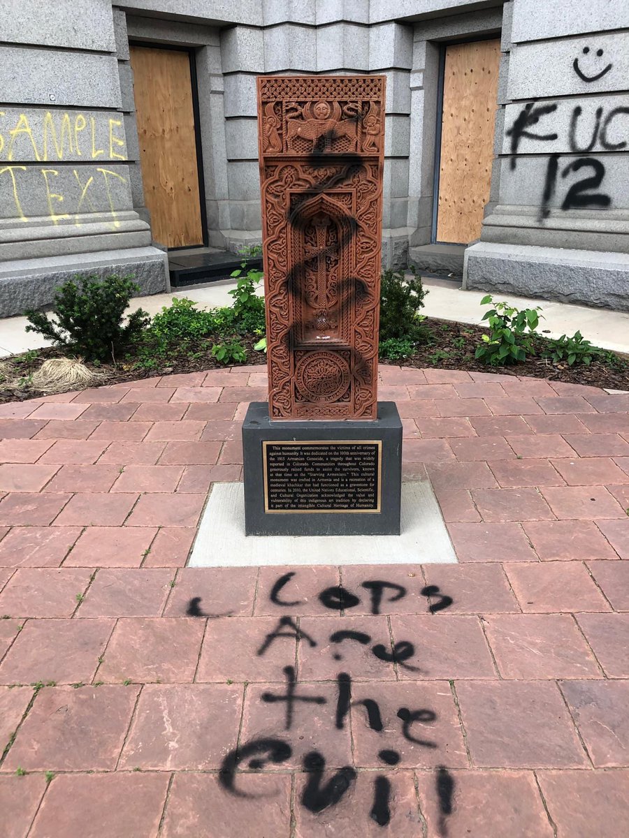 algalitsky's tweet photo. The Armenian Genocide monument in Denver sadly became collateral in the protests today.

But we understand the outrage, we understand the pain. 

Our monument honors all victims of #genocide, &amp; the only people responsible for its desecration are those perpetrating genocide today. https://t.co/o00aq2OyBW