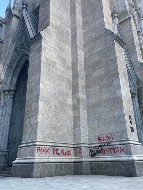RaymondArroyo's tweet photo. St. Patrick's Cathedral...this is a disgrace. How does defacing a house of prayer achieve justice? https://t.co/KYC3IVyn8S