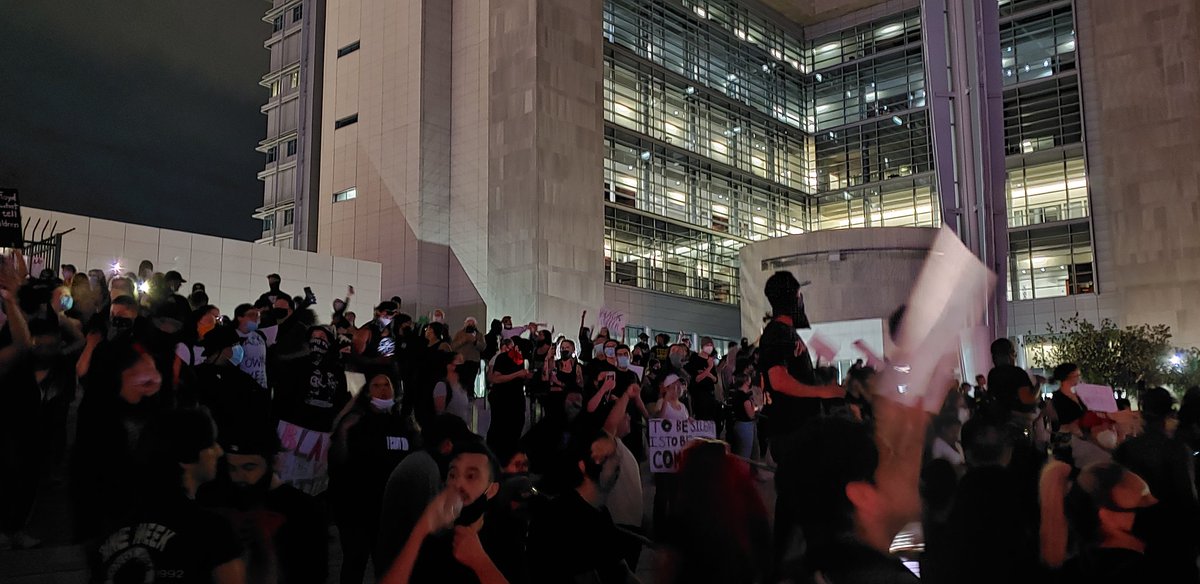 Protesters have stopped on the steps of the courthouse.