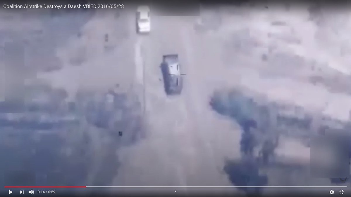 We have an armored Islamic State truck bomb driving toward its target, and a little white car goes past it.The video is edited.These are successive frames. The frames between them were taken out.