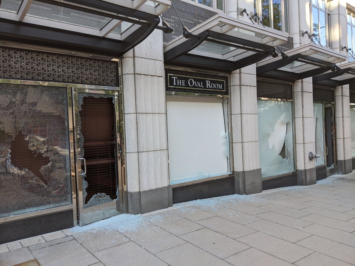 The Oval Room"s windows are smashed and the front is graffitied:"The Rich aren't safe anymore."