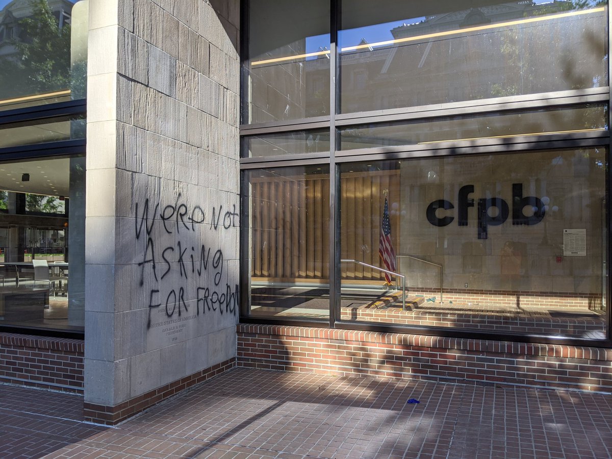 At the Consumer Financial Protection Bureau, graffiti:"We're not asking for freedom"